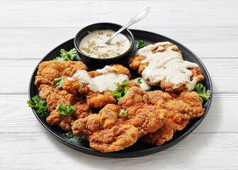 Deep fried Southern chicken thighs with milk gravy