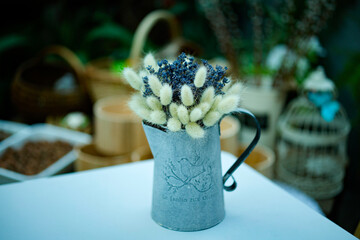 bouquet of dried flowers in decorative jar