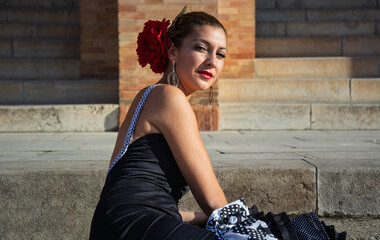 the girl in the flamenco dress with the intense look