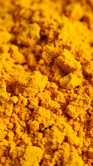Finely ground turmeric powder displays a vibrant golden color, highlighting its rich aroma and health benefits. This spice is ideal for enhancing flavor in various cuisines and dishes.