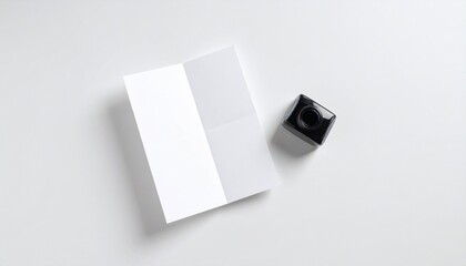 Blank Tri-Fold Brochure Mockup with Inkwell on White Background Perfect for Branding and Design Presentations.