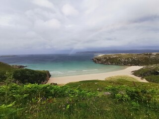 Remote beach in northern Scotland with turquoise water in spring