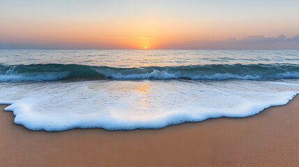 Obraz premium Serene Ocean Sunset: Soft Waves on Sandy Beach