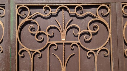 Ornate wrought iron gate with intricate scrollwork design