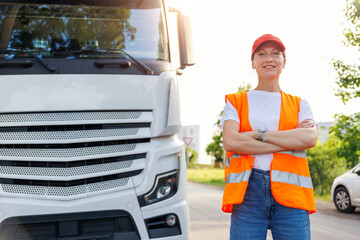 Portrait young adult happy smiling woman heavy truck driver modern cargo vehicle cabin background. Female person girl professional job career working driving freight engine lorry. Logistics industry