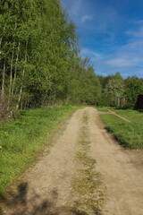 Vertical photo Dirt road in rural spring landscape.