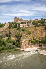 Vertical Outside View of Toledo Town with Monastery of San Juan de los Reyes. Beautiful Scenery of Town with Tagus River in Municipality of Spain.