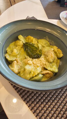 Exquisite Serving White Restaurant Plate of Ravioli 4 Cheeses with Cheese Espoume. Traditional Delicacy Italian Dumplings