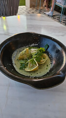 Seafood tortellini with pesto sauce in plate ready to eat