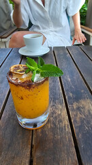 Chilli cocktail with tequila, mango and mint leaves
