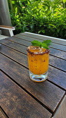 Chilli cocktail with tequila, mango and mint leaves