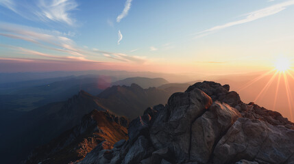 Spectacular Mountain Sunrise: A breathtaking sunrise illuminates rugged mountain peaks, with the sun's radiant glow casting a golden hue across the tranquil sky, a testament to nature's grandeur.