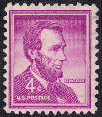 Old vintage cancelled postage stamp printed in the USA circa 1954, depicting president of America...