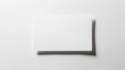 Blank white paper sheet on a plain white background with subtle shadows for a clean and minimal design