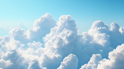 White puffy cumulus clouds against a serene light blue sky background