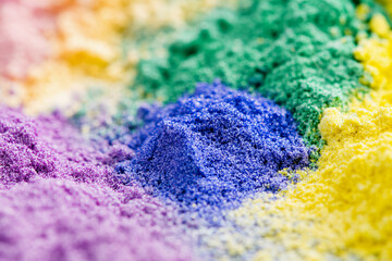 Obraz premium Vibrant close-up of colorful powdered pigments on surface Generative AI