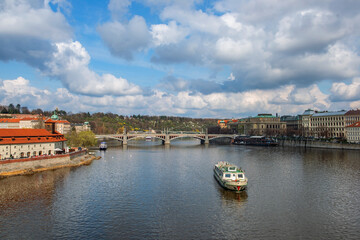 Picturesque view of the Vltava River in the center of the capital of the Czech Republic, Prague, on a spring day