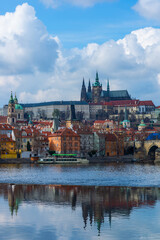 Obraz premium The Vltava River in the center of the Prague, Czech Republic, on a cloudy spring day 