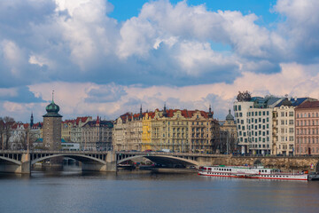 Obraz premium Picturesque view of the Vltava River in the center of the capital of the Czech Republic, Prague, on a spring day