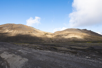 Breathtaking Icelandic landscape with lava rocks and iconic moss under a sunny sky on the Snaefellsnes Peninsula in western Iceland — a stunning display of raw natural beauty