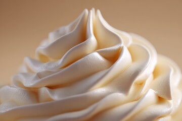 Close-up of a swirl of frosting. Sweet topping, dessert decoration, buttercream icing, confectionery swirl