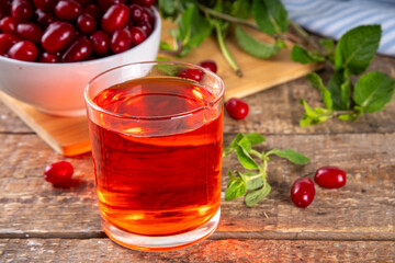 Cornelian cherry, dogwoods edible berry juice or liquor in glass