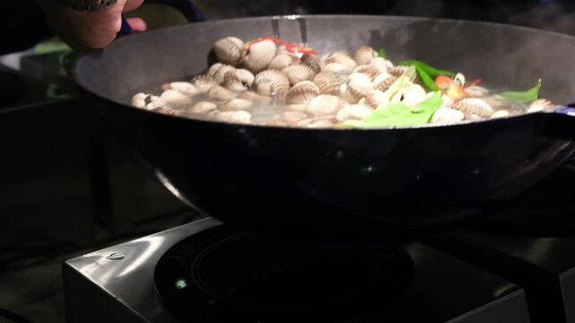 Stir fried clams with chili paste. High quality 4k footage