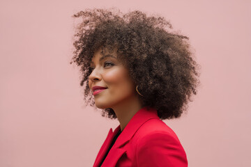 Portrait of an attractive middle-aged African American businesswoman in a red blazer with afro hairstyle. 