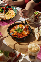 Hearty Turkish Breakfast with Simit and Menemen