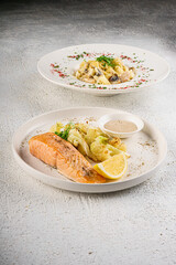 Pasta with Cream Sauce and Herbs on White Plate