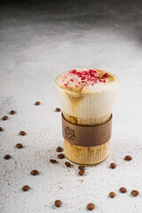 Creamy Latte Coffee with Coffee Beans on White Background