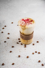 Latte Coffee with Cocoa Powder and Coffee Beans