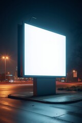 Empty digital billboard in urban setting at night with bright illumination and copy space for advertisement mockup