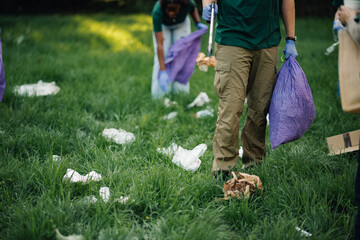 Volunteers picking up trash in a public park