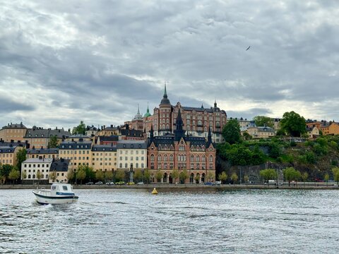 Historic buildings and boat in Södermalm, Stockholm on a cloudy day