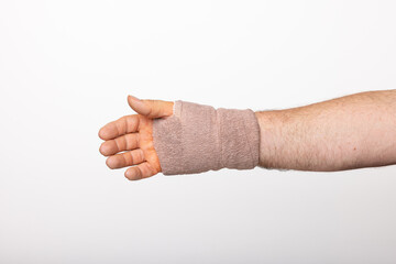 A Man's Hand and Wrist Wrapped In A Bandage