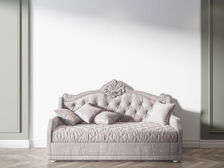 A white couch is in front of a white wall in a living room