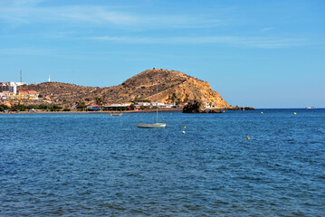 beach in Mazarrón, Spain, with red rocks the beach is characterized by fine golden sand and crystal clear water, town located in the region of Murcia, in the south-east of Spain