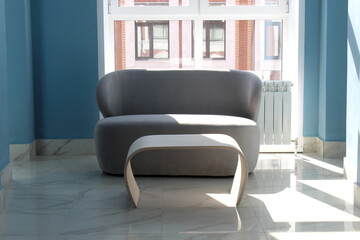 Small chairs with tables indoors.	