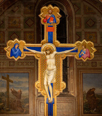 FLORENCE, ITALY - MARCH 17, 2025: The medieval painting of Crucifixion in the church chiesa di San Salvatore in Ognissanti by Giotto (1315).