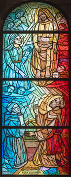 FLORENCE, ITALY - MARCH 21, 2025: The St. Francis of Assisi Jesus and Virgin Mary on the modern stained glass in the church Chiesa di San Francesco by P. Alberto Farina from year 1994.