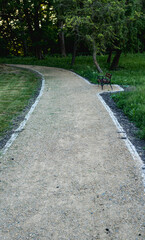 Ground path through a park made of small rocks