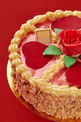 Delicious pink cake decorated with hearts and rose for braun family