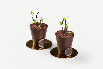 Chocolate flower pots with decorative flowers and crumbles representing soil