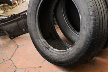 Tire with stagnant water, potential source of dengue or malaria mosquitoes