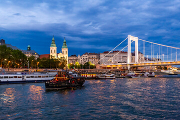 Beautiful view of the historical buildings and the Elisabeth Bridge illuminated in twilight in Budapest, Hungary