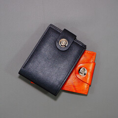 leather wallet together on grey background closeup shot  