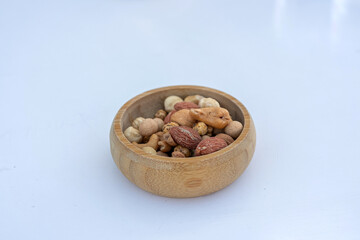 White roasted chickpeas in bowl. Turkish leblebi, famous nut, stack of yellow white roasted chickpea in burlap sack on wooden rustic background, white roasted chickpeas