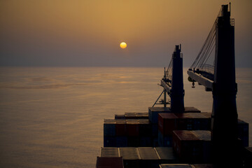 Container ship underway at sea in the morning