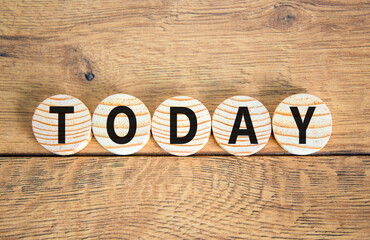 Today symbol. Concept word Today on beautiful wooden circles. Beautiful wooden table wooden...